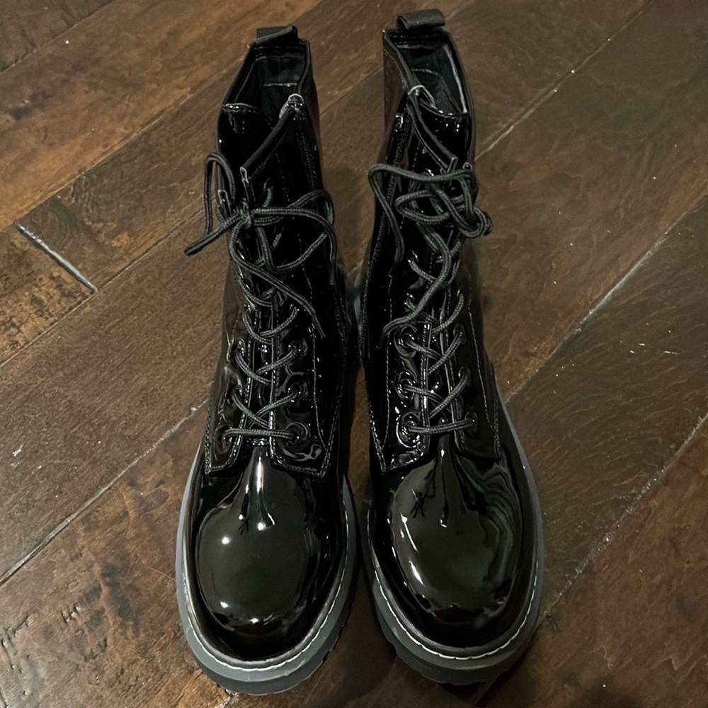 Wild pair women’s size 10 black faux patent leather boots.